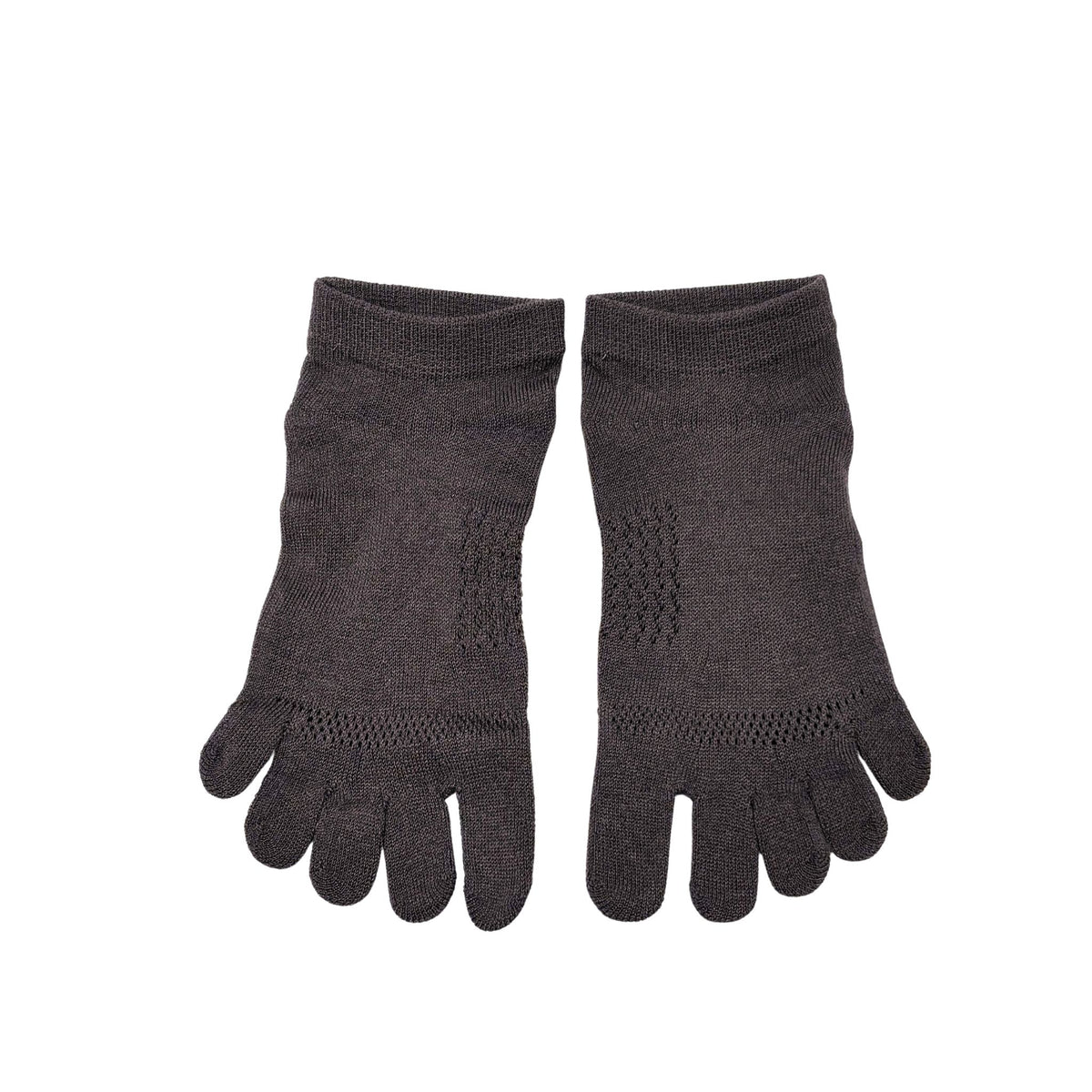Pair of beige toe-separated socks on a white background
