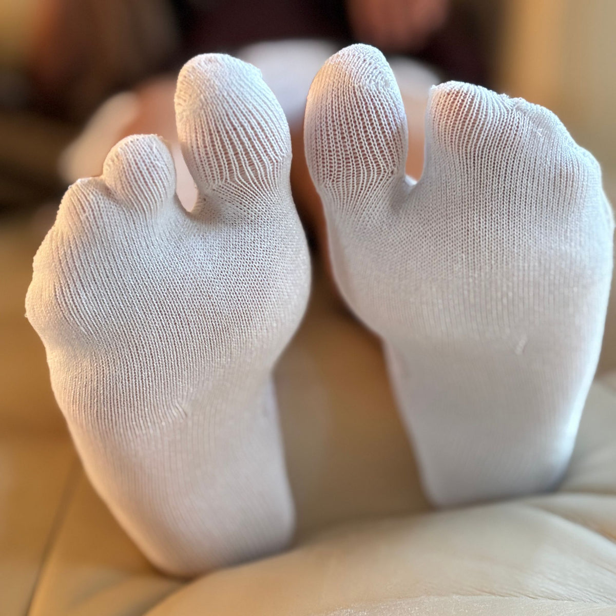 White five-finger socks on a blurred background