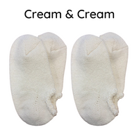 Airy Grace Organic Cotton Slipper Socks with Fuzzy Trim. Moisture-absorbing and heat-retaining properties. Undyed in a natural color, featuring a cozy, double-knit ribbed 