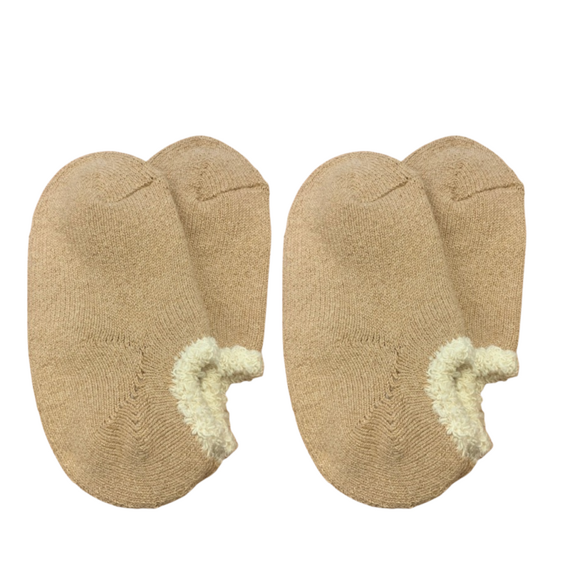 Airy Grace Organic Cotton Slipper Socks with Fuzzy Trim. Moisture-absorbing and heat-retaining properties. Undyed in a natural color, featuring a cozy, double-knit ribbed 