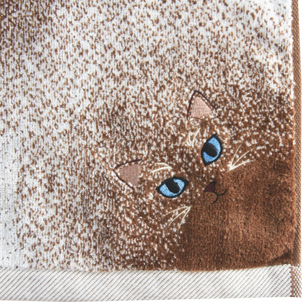 Embroidered design of a cat on a textured fabric background