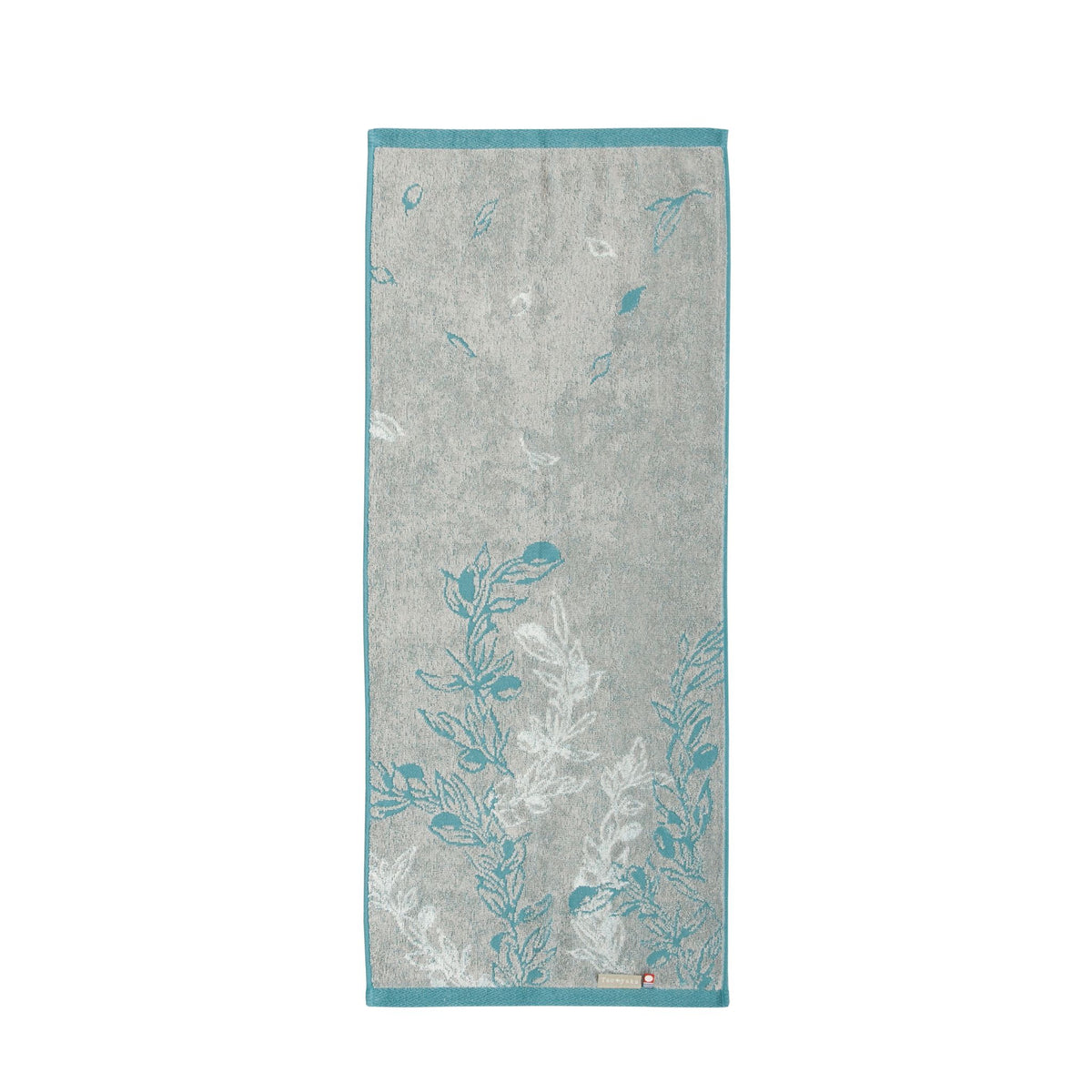 Gray towel with blue floral patterns on a white background