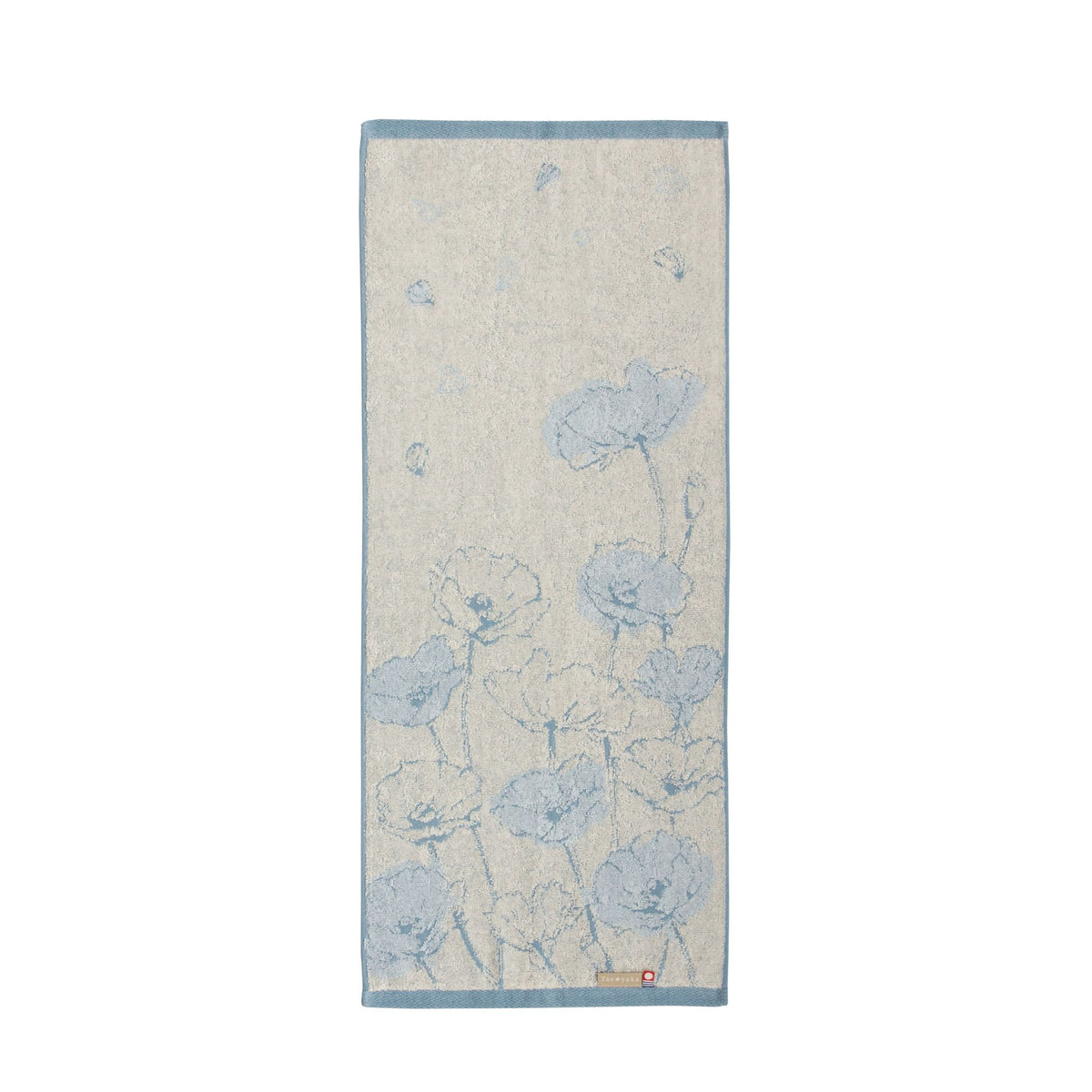 Floral patterned towel with blue flowers on a beige background