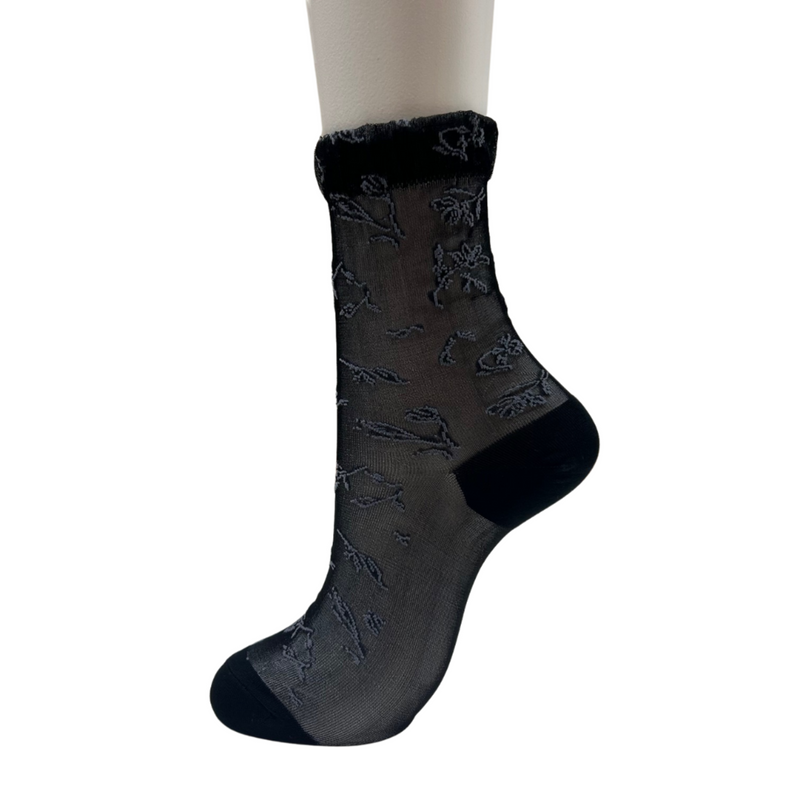 Stylish Sheer Floral Pattern Crew Socks with a chic, modern design. Made from soft, breathable fabric for all-day comfort. Perfect for versatile styling—from office wear to casual outfits. CHERRYSTONEstyle