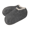 Angora Slipper Socks with anti-slip soles featuring transparent grip dots for extra safety. Each pair is handcrafted, incorporating traditional craftsmanship, and finished with cherrystone shell-shaped embroidery on the sock opening. Soft, cozy, and comfortable for ultimate foot pampering.