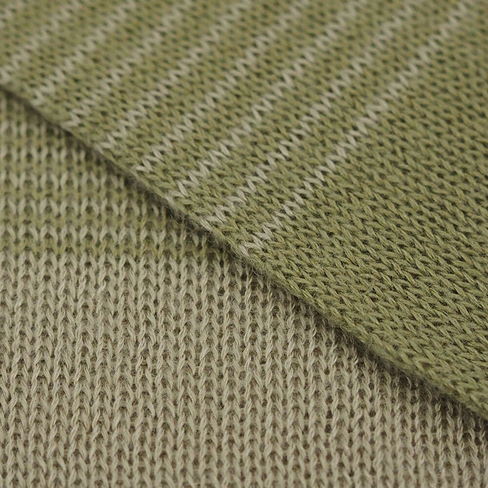 Close-up of green and beige woven fabric