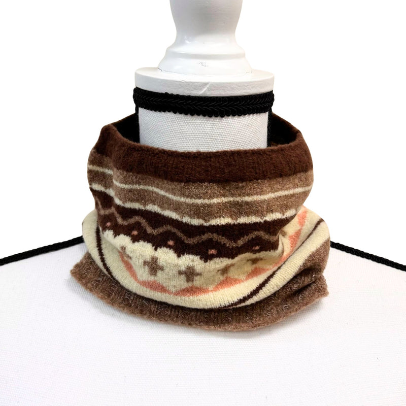 Brown and beige patterned scarf on a white mannequin