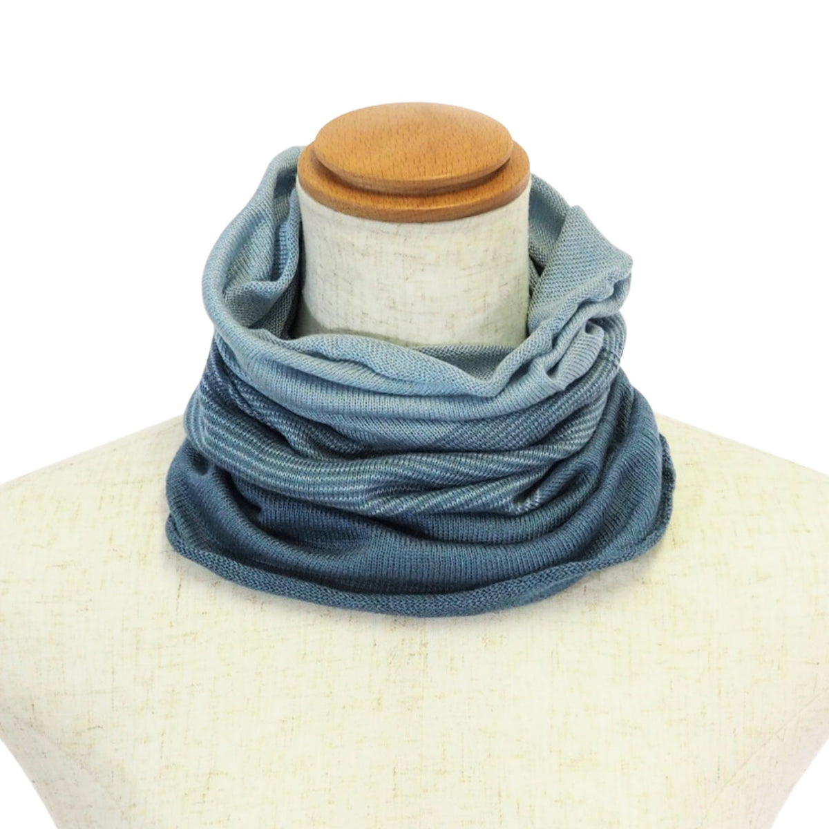 Blue scarf on a mannequin with a white background