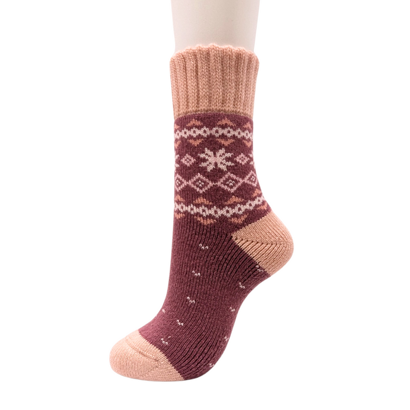 Warm Nordic Slipper Crew Socks made from a merino wool blend with thick ribbed cuffs to block cold air and a brushed lining for added cushioning. The soles feature invisible non-slip grips. Available in four stylish colors, perfect as a gift or for cozy days at home.