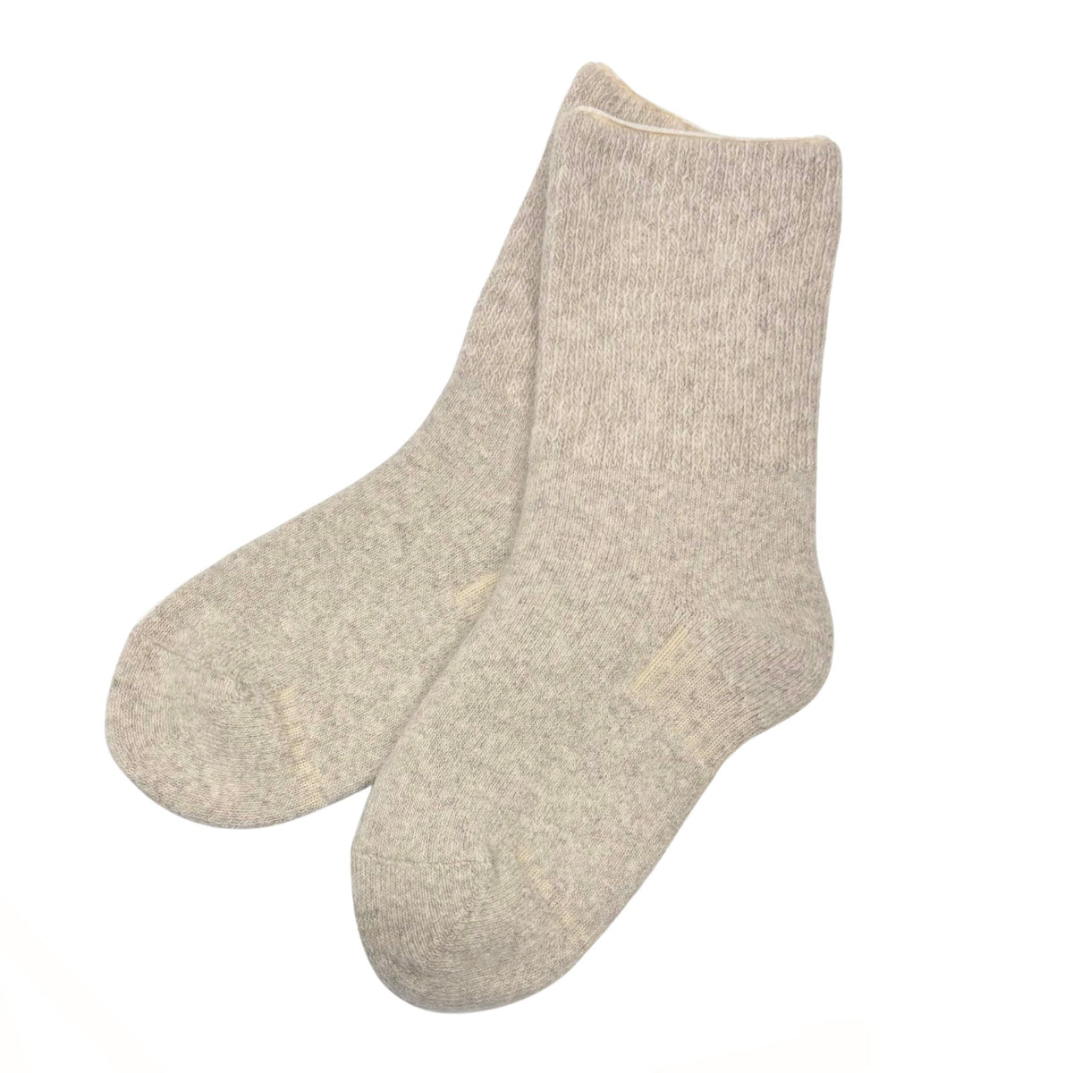 A pair of light beige heathered wool socks shown against a plain white. background.