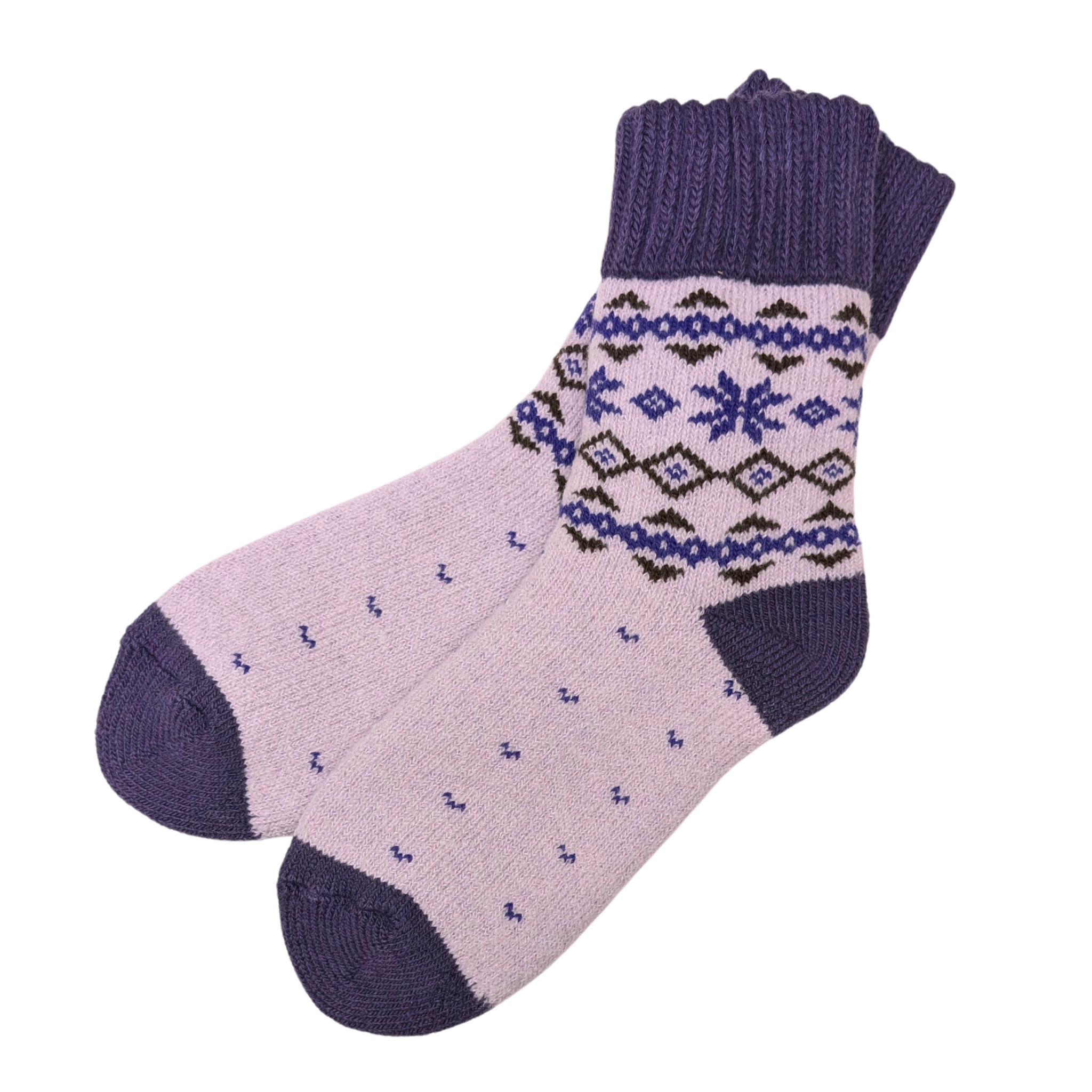 Warm Nordic Slipper Crew Socks made from a merino wool blend with thick ribbed cuffs to block cold air and a brushed lining for added cushioning. The soles feature invisible non-slip grips. Available in four stylish colors, perfect as a gift or for cozy days at home.