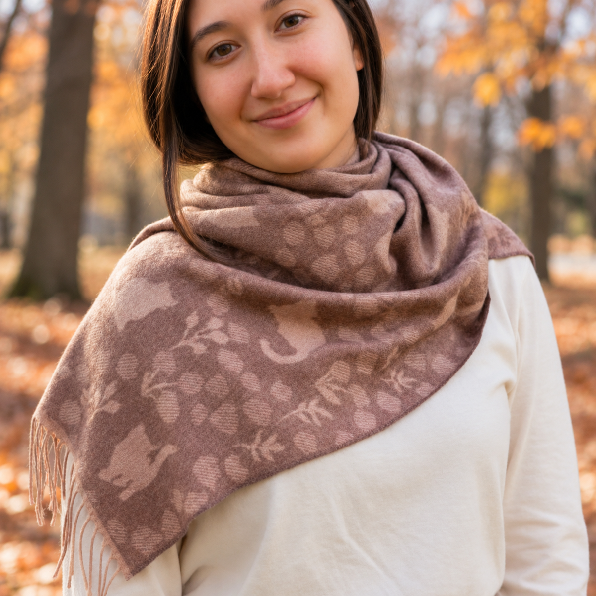 Woman wearing a cat patterned scarf.