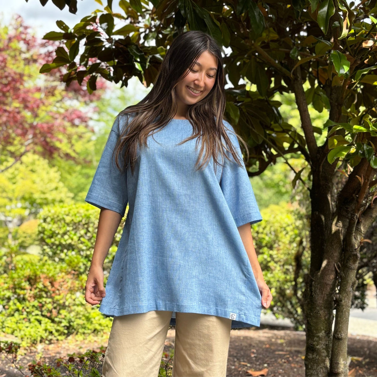 woman wearing a blue tunic.